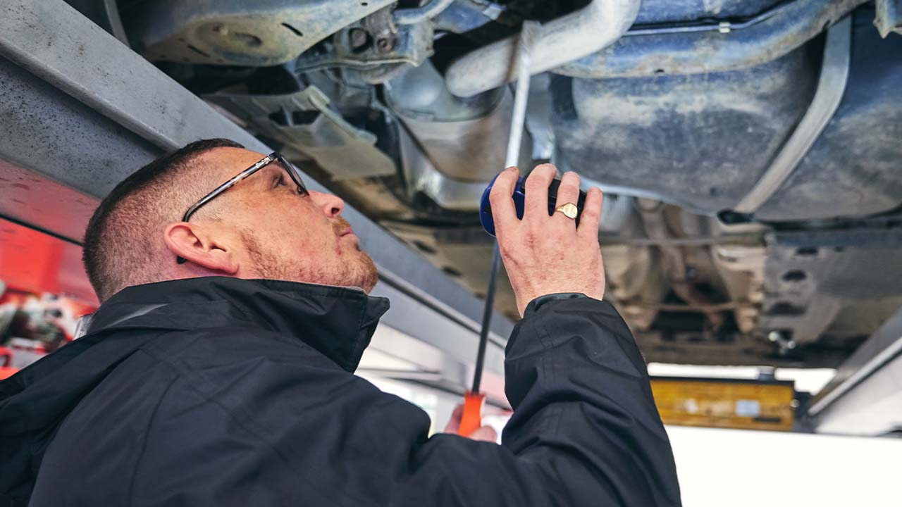 Technician performing vehicle health check
