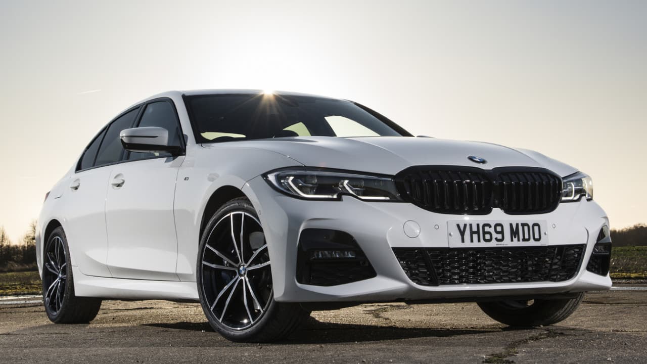 BMW 330e Driving Rear Angle in Grey