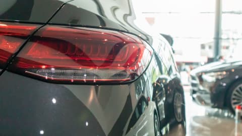 Close up of a black Mercedes-Benz Coupe's rear light cluster