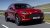Red Aston Martin DBX Exterior Front Driving