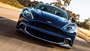 Blue Aston Martin Vanquish S Exterior Front Driving
