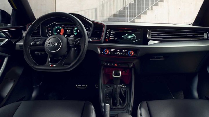 Audi A1 Sportback interior, showing the steering wheel and infotainment screen