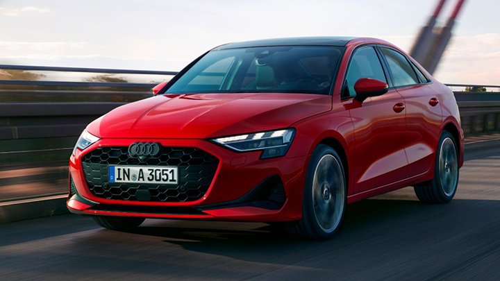 Front quarter driving shot of a red Audi A3 Saloon