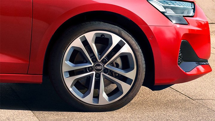 Close up of a red Audi A3 Saloon's front wheel
