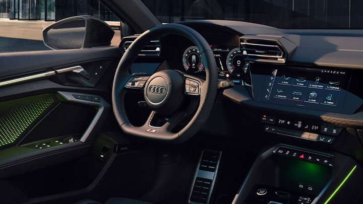 Close up of an Audi A3 Sportback's steering wheel and infotainment system
