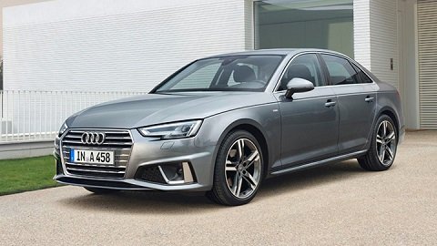 Front static shot of a silver Audi A4 Saloon parked in front of a house