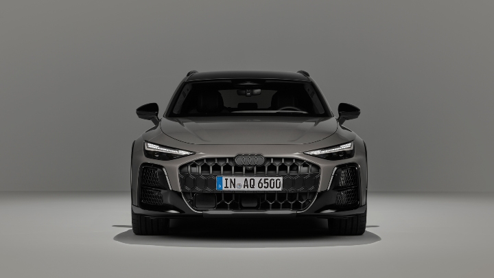 Front view of a grey Audi A6 allroad quattro with a prominent single-frame grille