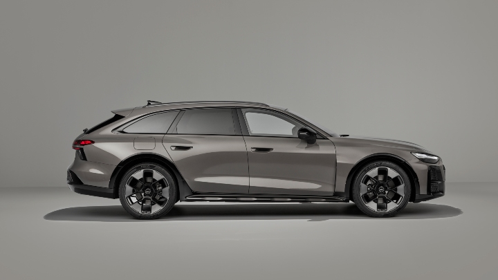 Side profile of a grey Audi A6 allroad quattro highlighting its raised ride height and estate body style