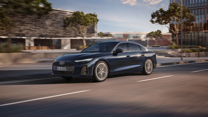 Dark Blue Audi A6 Saloon driving front end