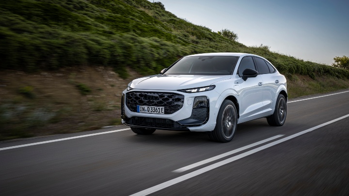 White Audi Q3 Sportback driving country road