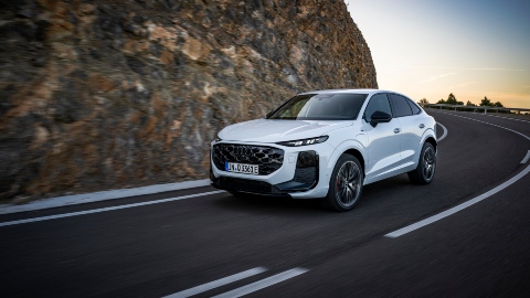 White Audi Q3 Sportback driving mountain road