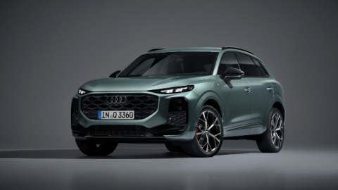 Green Audi Q3 suv Front right angle