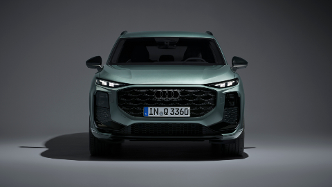 Green Audi Q3 SUV front facing