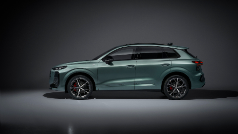 Green Audi Q3 SUV Side angle