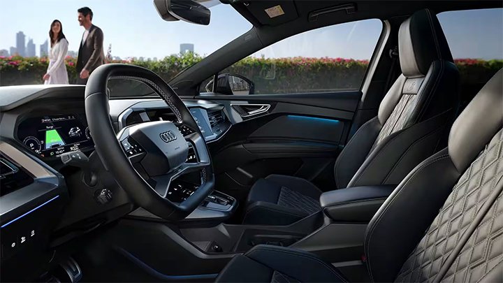 Side shot of an Audi Q4 e-tron's interior, including seats and steering wheel