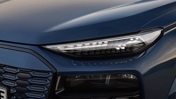 Close up of a blue Audi Q6 e-tron's headlight
