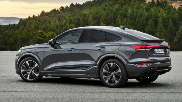 Audi Q6 Sportback e-tron in Dark Grey Rear Side Static Angle