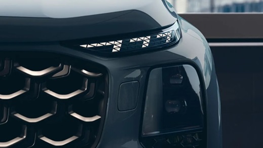 Audi Q7 front light and grille close-up showing LED daytime running lights