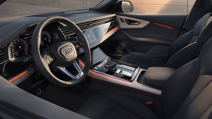 Close up of an Audi Q8's interior, including the steering wheel and centre console