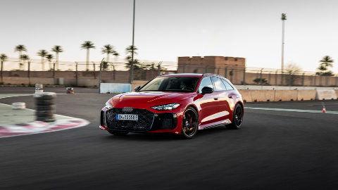 Red Audi RS 5 Avant driving circuit