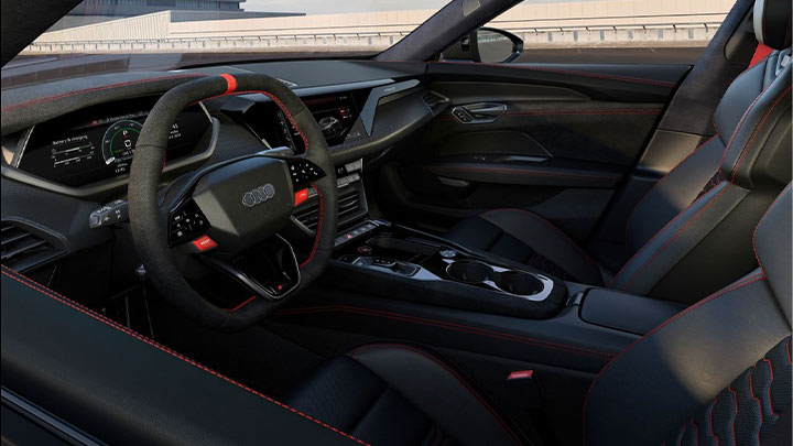 Close up of an Audi RS e-tron GT's interior, including the steering wheel and centre console