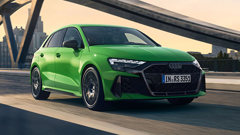 Green Audi RS3 Sportback Driving Over Bridge