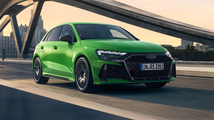 Green Audi RS3 Sportback Driving Over Bridge