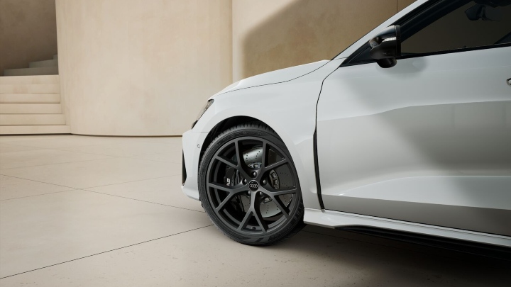 Close-up of an Audi RS 3 alloy wheel and performance brake system