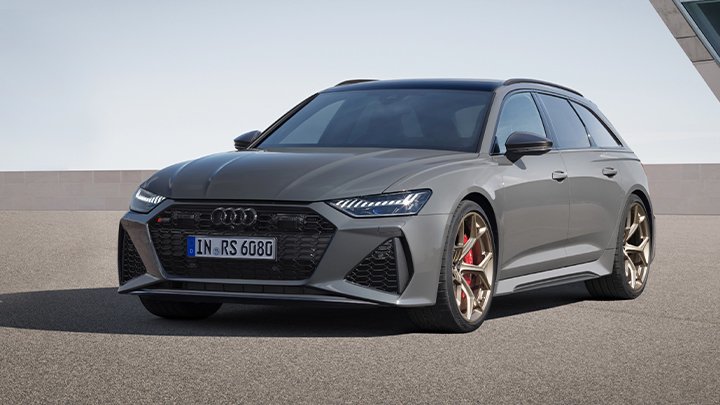 Front of a grey Audi RS6 Avant parked on the asphalt