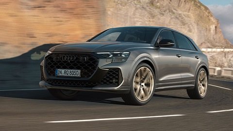 Grey Audi RSQ8 driving in a stone mountain