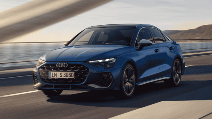 Front quarter driving shot of a blue Audi S3 Saloon