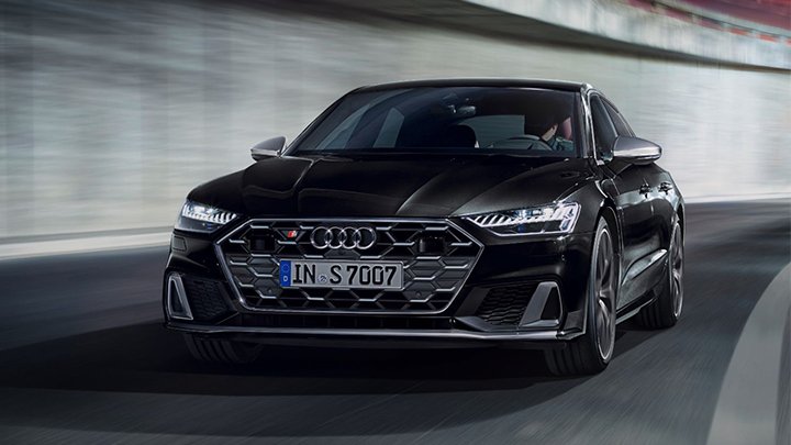 Black Audi S7 Sportback driving in a tunnel with grey walls