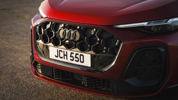 Red Audi SQ5 Sportback close up during sunset