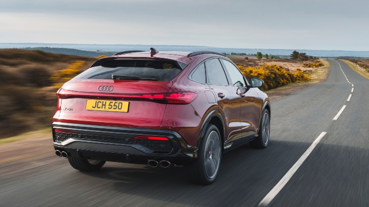 Red Audi SQ5 Sportback driving along country road