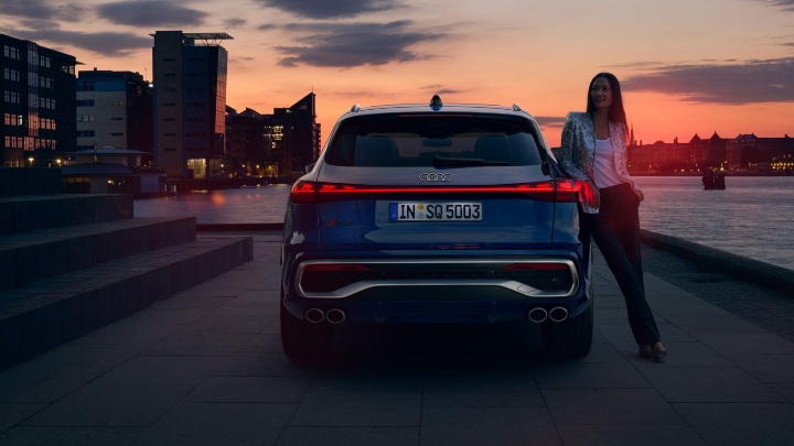 Blue Audi SQ5 SUV Exterior Rear with Person Near River