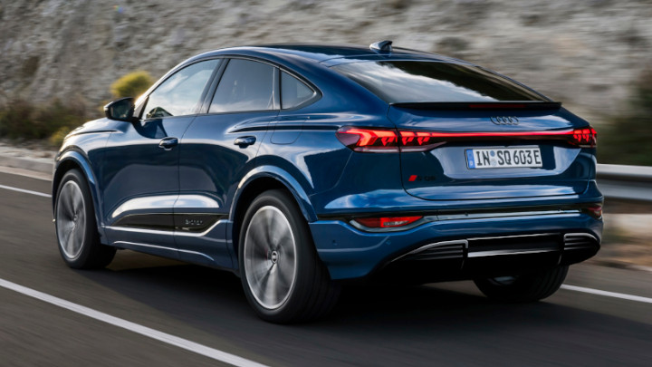 Audi SQ6 Sportback e-tron Driving Rear Angle in Blue