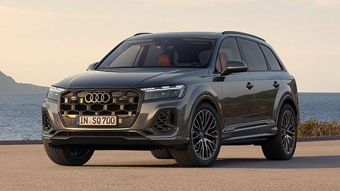 Grey Audi SQ7 Sportback parked on the asphalt in front of the ocean