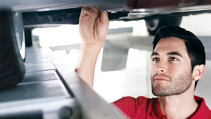 Technician Performing a Vehicle Health Check on Audi