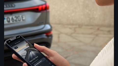 Woman checking myAudi app