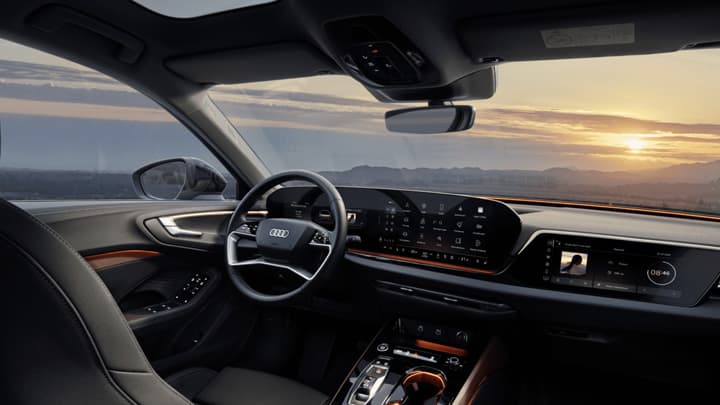 Interior of an Audi e-tron overlooking a sunset