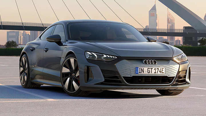Audi e-tron GT parked in front of a bridge