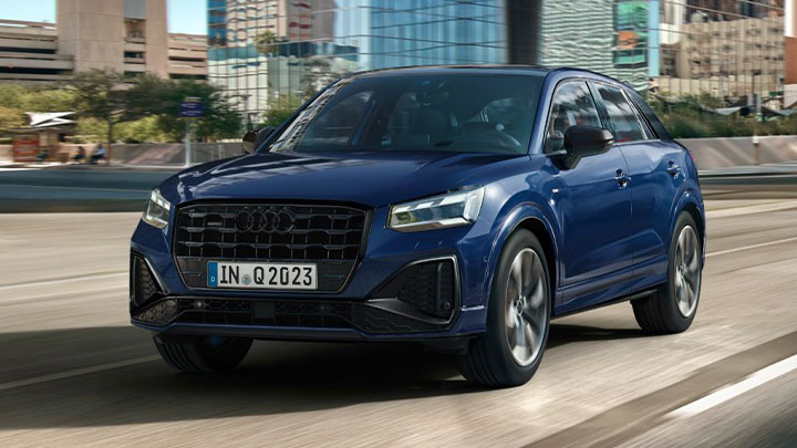 Dark Blue Audi Q2 Front Driving On Road