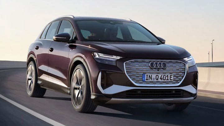 Burgundy Audi Q4 e-tron driving on a bridge