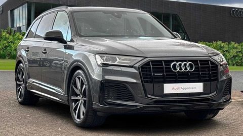 Audi Q7 S Line parked in front of a dealership