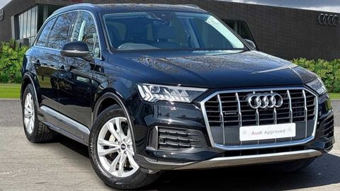 Audi Q7 Sport parked in front of a dealership