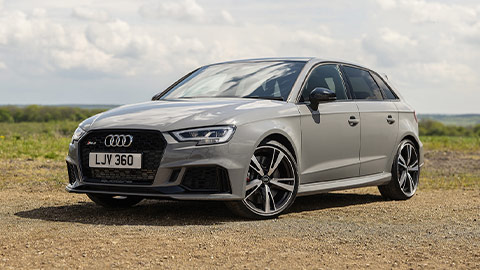 Grey Audi RS 3 parked on a country lay by