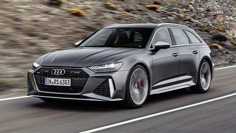 Grey Audi RS 6 driving down a country road