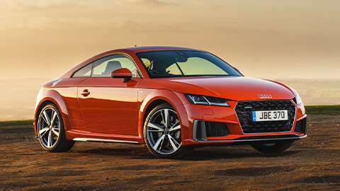 Red Audi TT parked on a country lay by