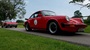 Two red Porsche 930 and 914.