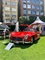 Red Mercedes 300SL with the doors open at London Concours 2019.